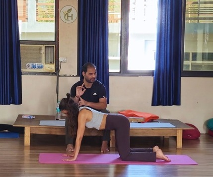 Student Practicing Cat Cow Pose