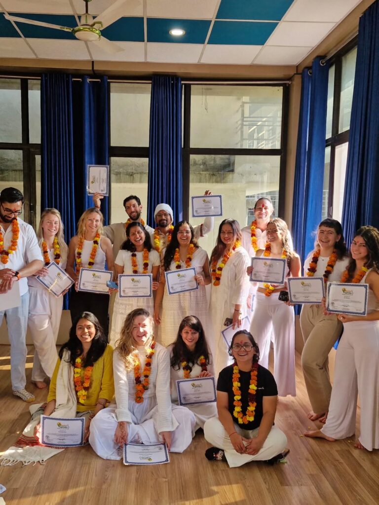 Student with their 200 hour yoga ttc certificate