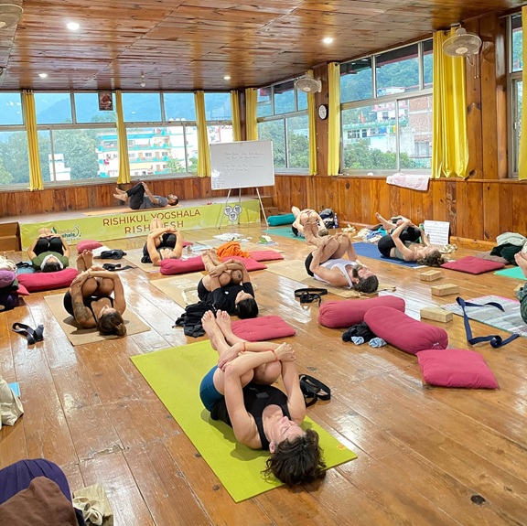 Students Performing Pawanmuktasana (Wind Relieving Pose)