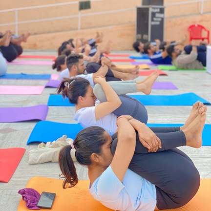 Student Performing Pawanmuktasana (Wind Relieving Pose)